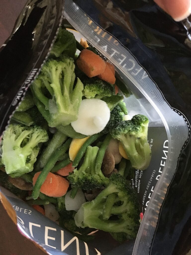 looking into bag of frozen vegetables