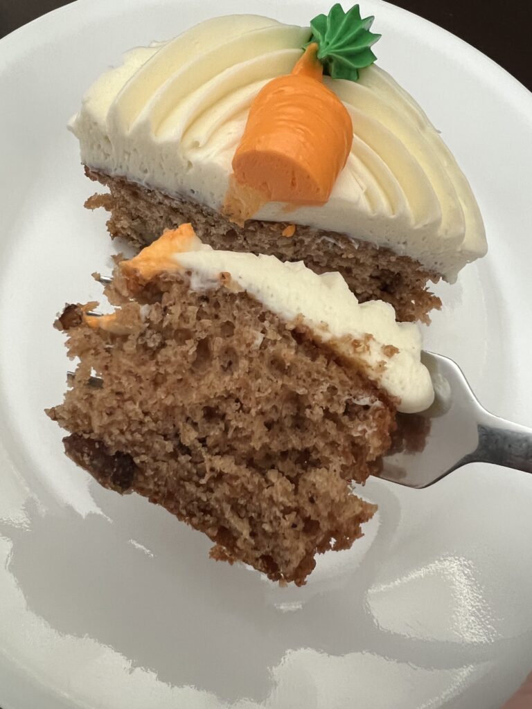 close up of carrot cake on fork