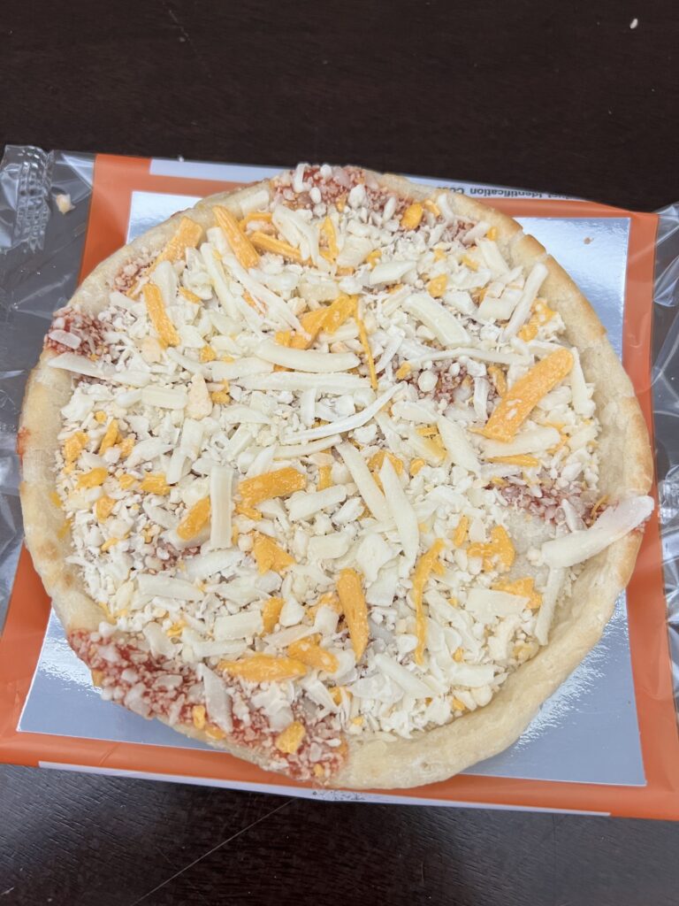 close up of frozen cheese pizza