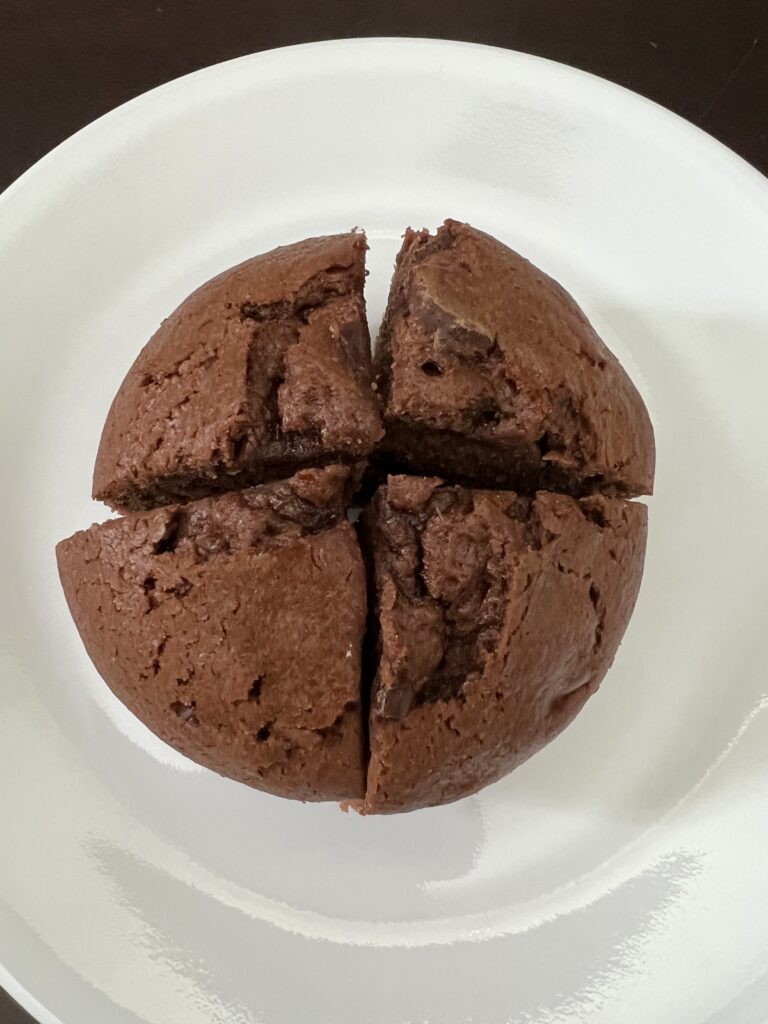 chocolate muffin cut in four pieces