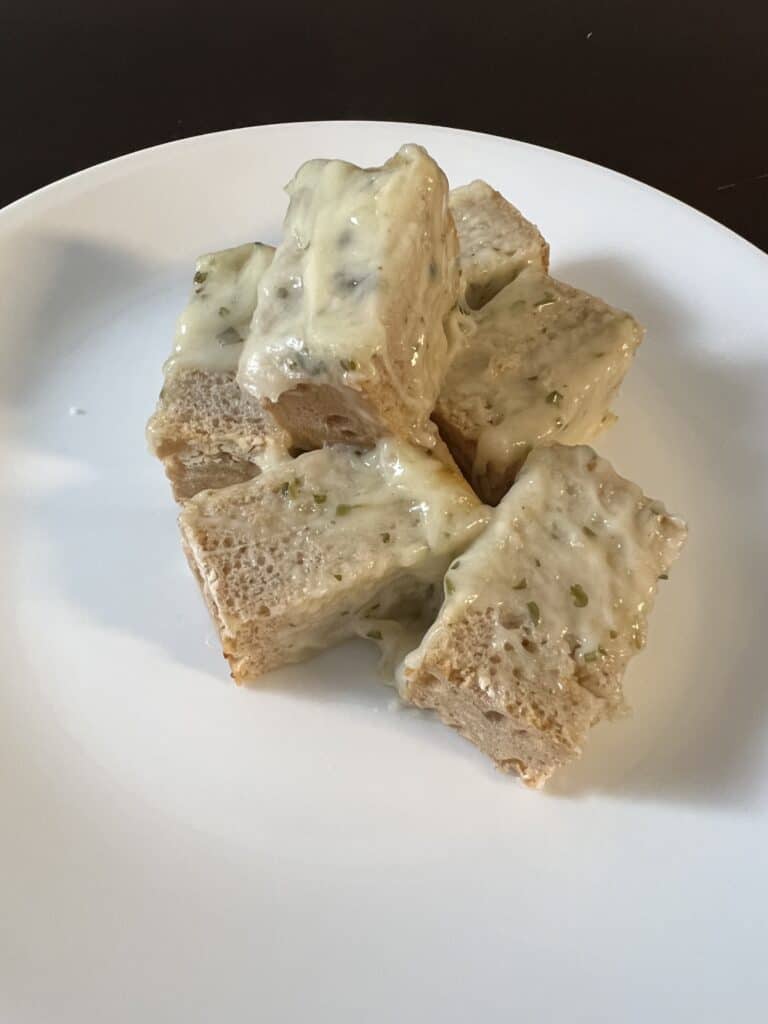 pieces of cheese bread on a plate