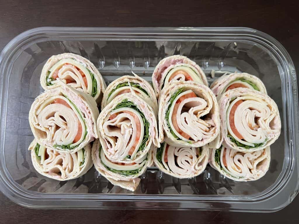 12 rollers in a clear plastic tray